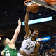 Giannis Antetokounmpo dunks over Aron Baynes of the Boston Celtics on Sunday.